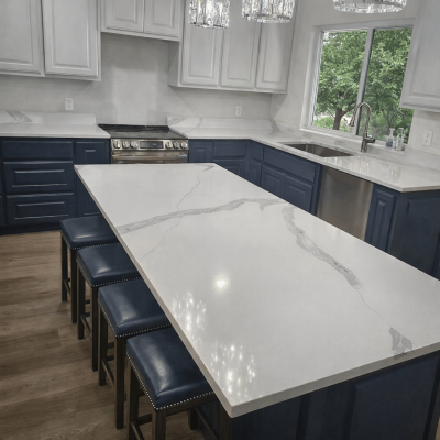 Kitchen remodel featuring large quartz island and two-tone cabinets in Argyle TX by Bochart Builders